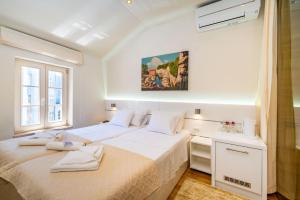 Posteľ alebo postele v izbe v ubytovaní Idassa Palace rooms