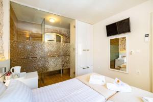 Posteľ alebo postele v izbe v ubytovaní Idassa Palace rooms