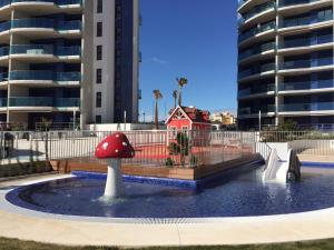 Bazén v ubytovaní SEA SENSES - Punta Prima - VISTA AL MAR alebo v jeho blízkosti