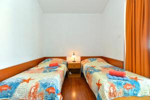 Postel nebo postele na pokoji v ubytování Pool Apartments 624