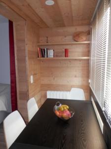 a bowl of fruit on a table in a room at L'Adroit in Barcelonnette