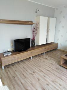 a living room with a flat screen tv on a table at Apartment See Breeze in Sunny Beach