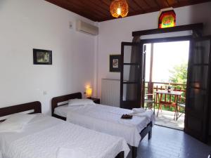 Posteľ alebo postele v izbe v ubytovaní Hotel Vrionis