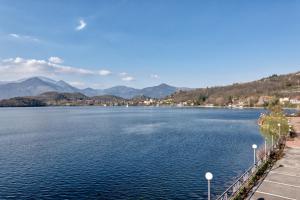 a view of a lake with mountains in the background at CASA VACANZA IL SORRISO DEL LAGO in Avigliana