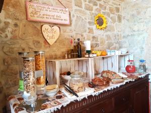 a table with bread and other items on it at Casale MilleSoli in Mugnano