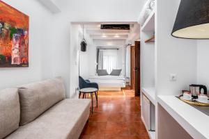 a living room with a couch and a table at Casa De La Sera in Rhodes Town