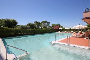 a pool with people playing in it at Hotel Sportsman in Bardolino