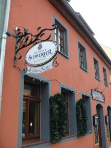 a building with a sign for a restaurant at 4 JahresZeiten in Meißen