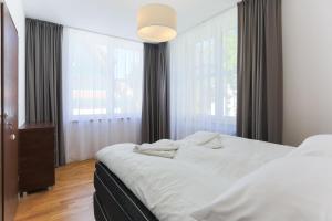 Posteľ alebo postele v izbe v ubytovaní Apartamenty Świnoujście - Rubin II