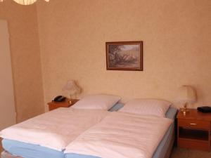 Postel nebo postele na pokoji v ubytování Hotel Richthofen