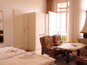 Postel nebo postele na pokoji v ubytování Hotel Richthofen