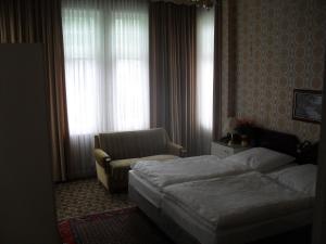 Postel nebo postele na pokoji v ubytování Hotel Richthofen