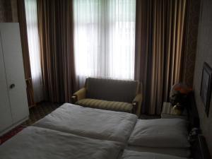 Postel nebo postele na pokoji v ubytování Hotel Richthofen