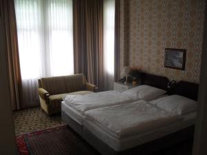 Postel nebo postele na pokoji v ubytování Hotel Richthofen
