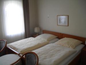 Postel nebo postele na pokoji v ubytování Hotel Richthofen