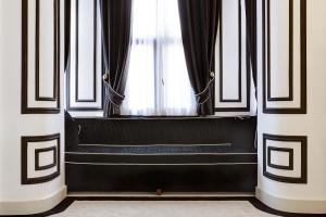 a window with a black bench in a room at Galata Antique Hotel - Special Category in Istanbul