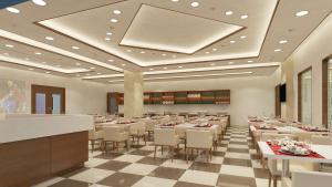 a restaurant with tables and chairs in a room at The Altruist Navi Mumbai Hotel in Navi Mumbai