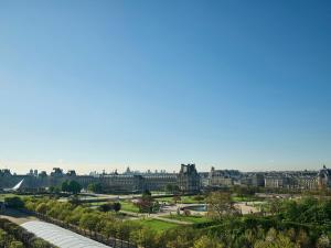 a view of the city of edinburgh from the top of the building at Le Meurice – Dorchester Collection in Paris