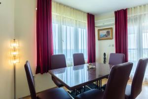 a dining room with a table and chairs at La Casa Primorsko in Primorsko