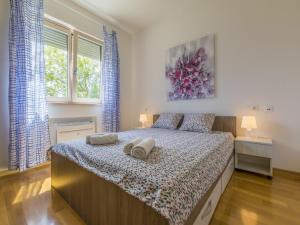 Katil atau katil-katil dalam bilik di Apartments MB