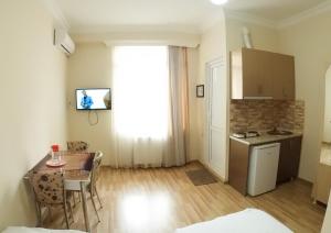Kuchyň nebo kuchyňský kout v ubytování Hotel Tao