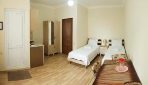 Postel nebo postele na pokoji v ubytování Hotel Tao