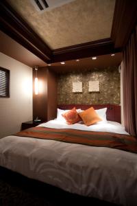 
Tempat tidur dalam kamar di Hotel Coco Grand Ueno Shinobazu
