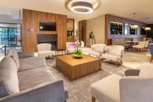 a living room with a couch and chairs and a table at Luxury Hotel Riva in Malinska