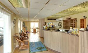 a bar in a restaurant with chairs and a counter at Gondolier Motel - Wildwood in Wildwood Crest