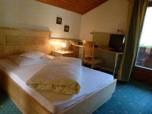 Postel nebo postele na pokoji v ubytování Hotel Stocker