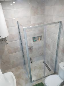 Koupelna v ubytování BEST Apartments + 9 fotografií