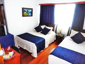 Postel nebo postele na pokoji v ubytování Hotel Casa Sarita