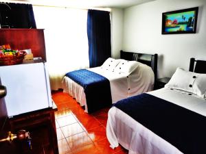 Postel nebo postele na pokoji v ubytování Hotel Casa Sarita