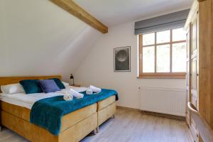 Posteľ alebo postele v izbe v ubytovaní Biała Owieczka B&B Szczyrk
