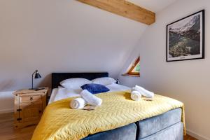 Posteľ alebo postele v izbe v ubytovaní Biała Owieczka B&B Szczyrk