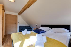 Posteľ alebo postele v izbe v ubytovaní Biała Owieczka B&B Szczyrk