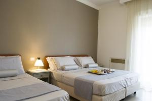a bedroom with two beds with a tray of food on it at Villa Donna Carmela in Pimonte +81 photos