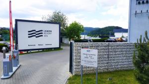 a sign for a hotel next to a fence at Apartment 68 - Lemon Resort Spa in Gródek Nad Dunajcem