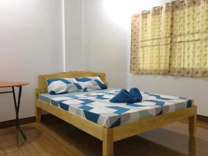 Кровать или кровати в номере Za Priscila Tourist Inn