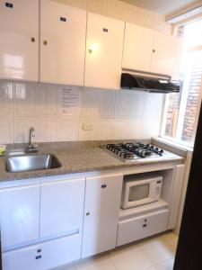 Kuchyň nebo kuchyňský kout v ubytování Hotel Casa Paulina