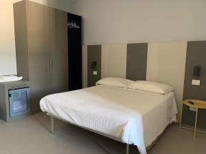 Postel nebo postele na pokoji v ubytování Locanda della Posta + 9 fotografií