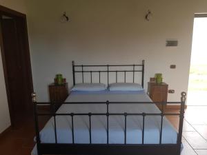 Uma cama ou camas num quarto em Palazzo Piccolo