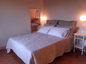 Ένα ή περισσότερα κρεβάτια σε δωμάτιο στο Agriturismo Fonteregia