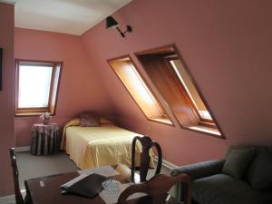Postel nebo postele na pokoji v ubytování Hotel Apart Colón