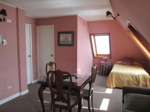 Postel nebo postele na pokoji v ubytování Hotel Apart Colón