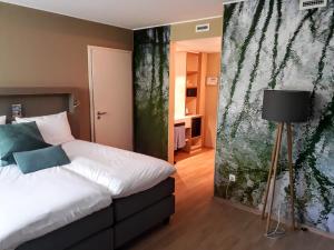 Una cama o camas en una habitación de Péitche Lauer