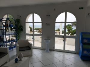 Posteľ alebo postele v izbe v ubytovaní Hotel Caraibisiaco sul mare