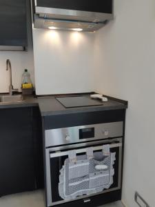 a kitchen with a stove and a sink in it at Casa Isabelle Mel in La Spezia