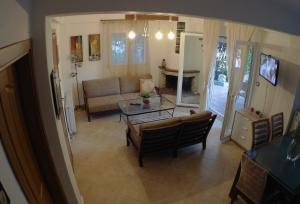 a living room with a couch and a table at Villa Evridiki in Fourka