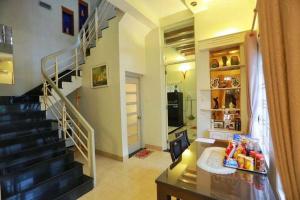 a living room with a spiral staircase in a house at Sea Villa - 22 Bà Triệu in Vung Tau